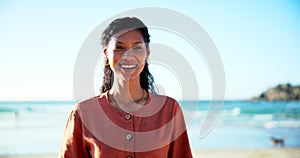 Woman, face and happy for holiday on beach, nature and relax in summer for travel adventure. Brazilian person, smile and