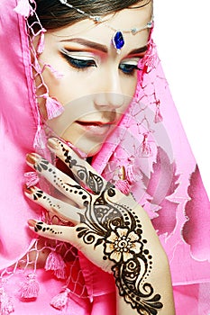 Woman face henna on hand