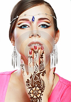 Woman face henna on hand