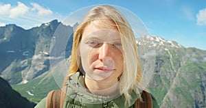 Woman, face and hiking in outdoors on trip, adventure and relaxing on vacation in Netherlands. Female person, portrait
