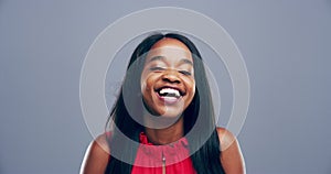 Woman, face and laughing at funny in studio or humor comedy or joke, mockup space on grey background. Black person