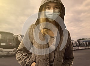 Woman with face mask in bus station