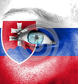 Woman face painted with flag of Slovakia