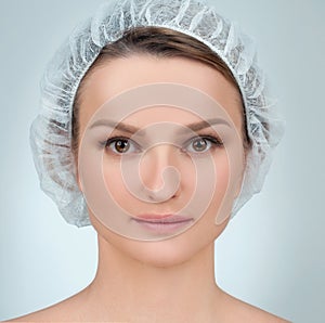 Woman face after plastic surgery. Anti-aging treatment and face lift.