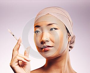 Woman, face and plastic surgery with injection and studio background with asian for skincare. Female model, cosmetic and