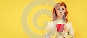 Woman  face portrait, banner with copy space. funny redhead girl with red heart on yellow background. valentines