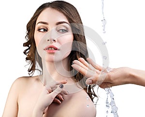 Woman face and pouring water in hand.