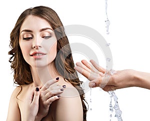 Woman face and pouring water in hand.