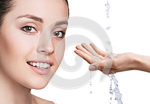 Woman face and pouring water in hand.