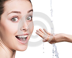 Woman face and pouring water in hand.