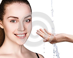 Woman face and pouring water in hand.