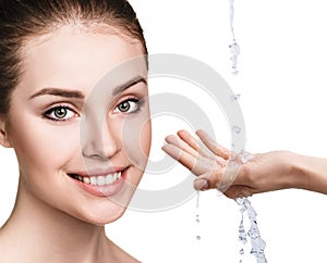 Woman face and pouring water in hand.