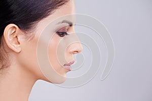Woman, face and profile with beauty and skin, dermatology and mockup space with cosmetics on white background. Makeup