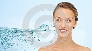 Woman face and shoulders over water splash