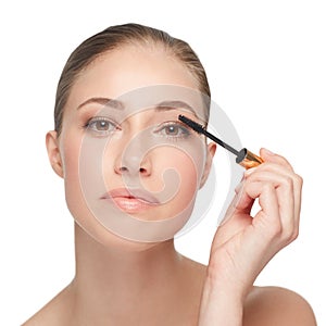 Woman, face and skincare for beauty, mascara and makeup with lashes and cosmetology on white background. Portrait, wand
