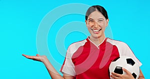 Woman face, soccer ball and hand show product placement, space or mockup on blue background. Portrait, smile and lady