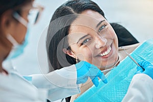 Woman, face and teeth whitening, dentist and dental with health, smile in portrait during procedure and treatment. Trust