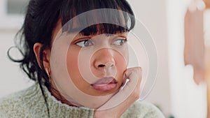 Woman face thinking, anxiety and sad in the living room while feeling worried, stress and fear. Young female thoughts