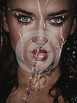 Woman face with water drop.