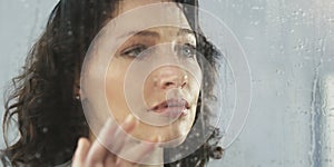 Woman, face and window, depression and mental health, thinking or reflection with crisis or life fail. Mistake, anxiety