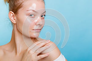 Woman in facial peel off mask.