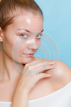 Woman in facial peel off mask.