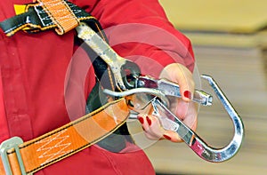 Woman and a fall protection harness