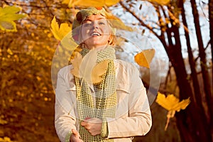 Woman with falling leaves