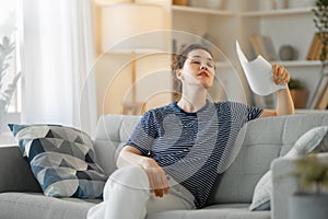 Woman fanning herself