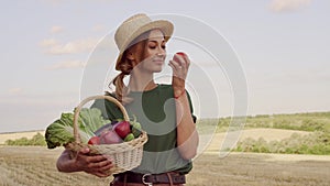 Woman farmer straw hat apron standing farmland smiling Female agronomist specialist farming agribusiness Happy positive