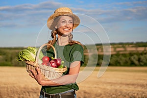 Woman farmer straw hat apron standing farmland smiling Female agronomist specialist farming agribusiness Happy positive caucasian