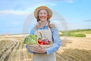 Woman farmer straw hat apron standing farmland smiling Female agronomist specialist farming agribusiness Happy positive caucasian