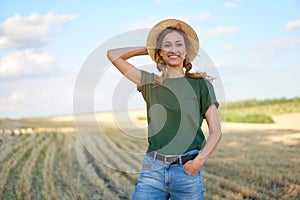 Woman farmer straw hat standing farmland smiling Female agronomist specialist farming agribusiness Happy positive caucasian worker