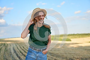 Woman farmer straw hat standing farmland smiling Female agronomist specialist farming agribusiness Happy positive caucasian worker