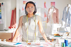 Woman, fashion and design in small business startup for clothing, styling or tailor at workshop. Portrait of asian