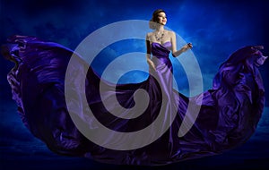 Woman Fashion Dress, Blue Art Gown Flying Waving Silk Fabric photo