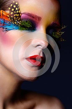 Woman with fashion feather eyelashes make-up