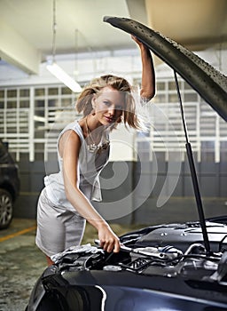 Woman, fashion and portrait or car engine for fix with spanner for maintenance for breakdown, mechanical or oil leak