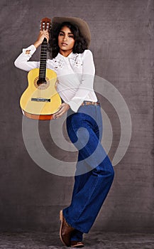Woman, fashion and portrait with guitar for instrument, musician and music for string and note for western and melody