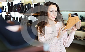 Woman at fashion shoe store