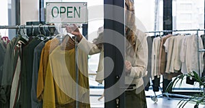 Woman, fashion store and closed sign on window, salesperson and clothing shop. Shopkeeper, retail worker and