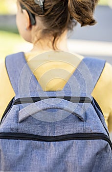 Woman with fashionable textile rucksack