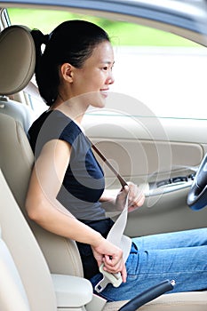 Woman fasten seatbelt