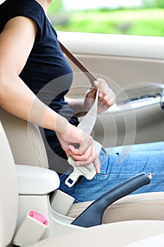 Woman fasten seatbelt photo