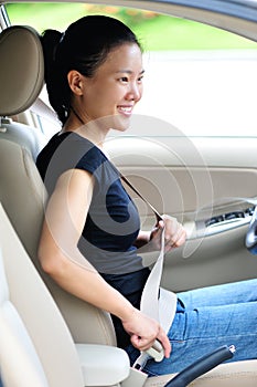Woman fasten seatbelt photo