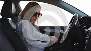 Woman fastening seatbelt