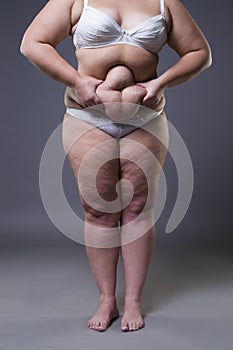 Woman with fat abdomen, overweight female stomach