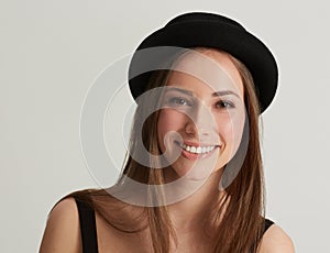 Woman, fedora and fashion with portrait in studio with confidence, pride and retro style by white background. Hipster