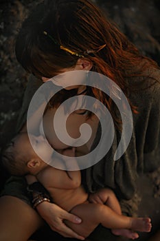 Woman feeding her small son