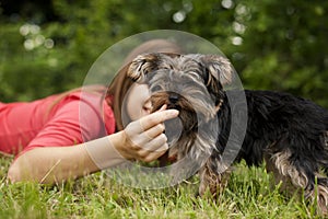 Woman feeding puppy